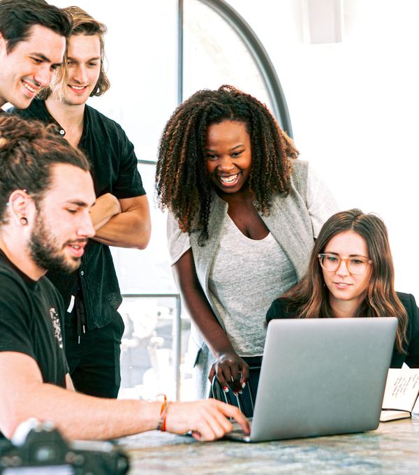 Marketing team reviewing results on a laptop